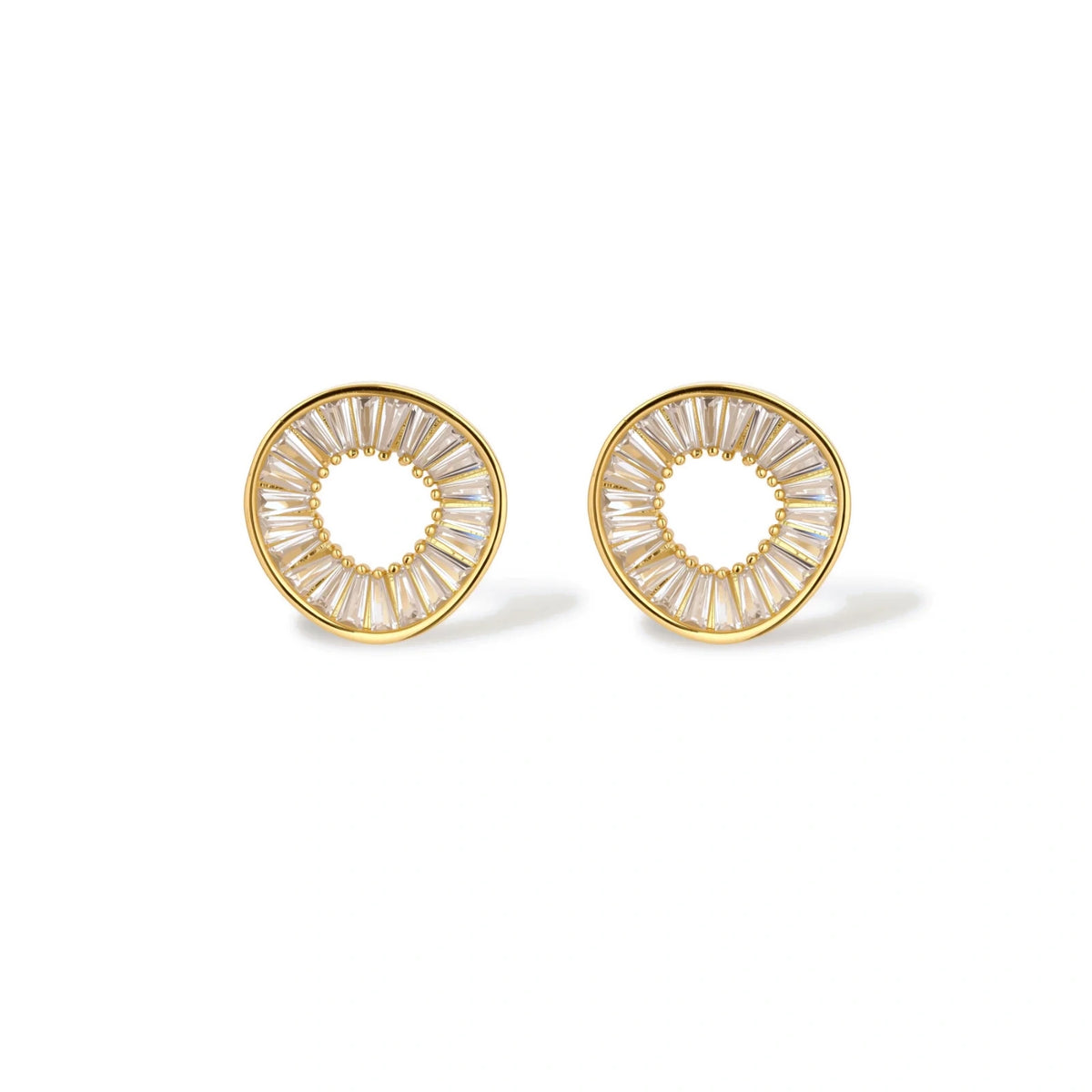 Gold-plated necklace and earring set with circular CZ crystal pendants featuring radial design on cream background