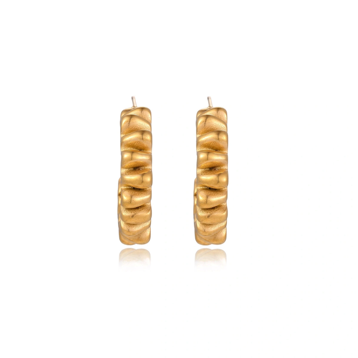 Sculptural gold-plated hoop earrings with continuous twisted spiral design on cream background