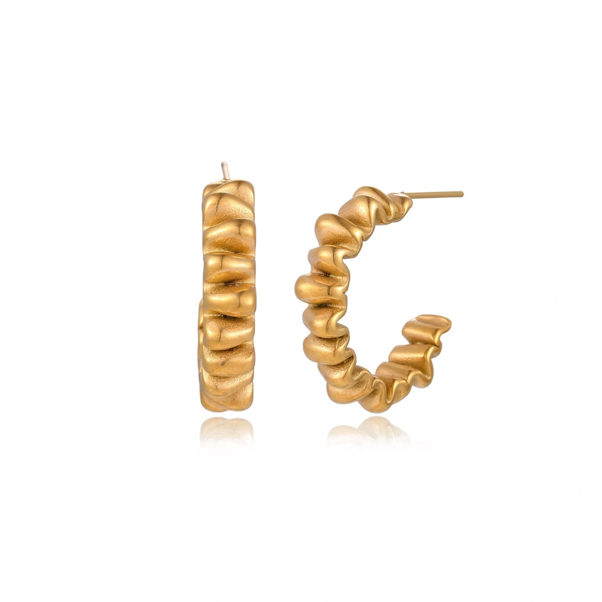 Sculptural gold-plated hoop earrings with continuous twisted spiral design on cream background