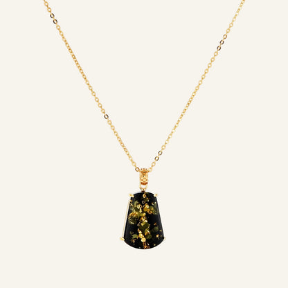 18k gold-plated necklace and earrings with green amber pendants featuring golden inclusions on cream background