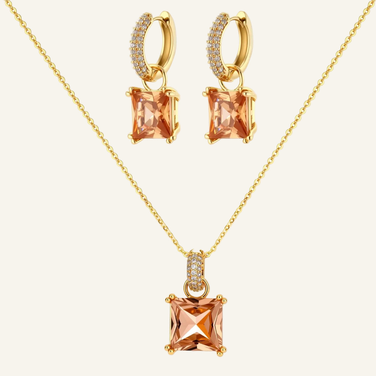 14K gold plated jewelry set featuring square champagne CZ stones with sparkling huggie earrings on cream background.