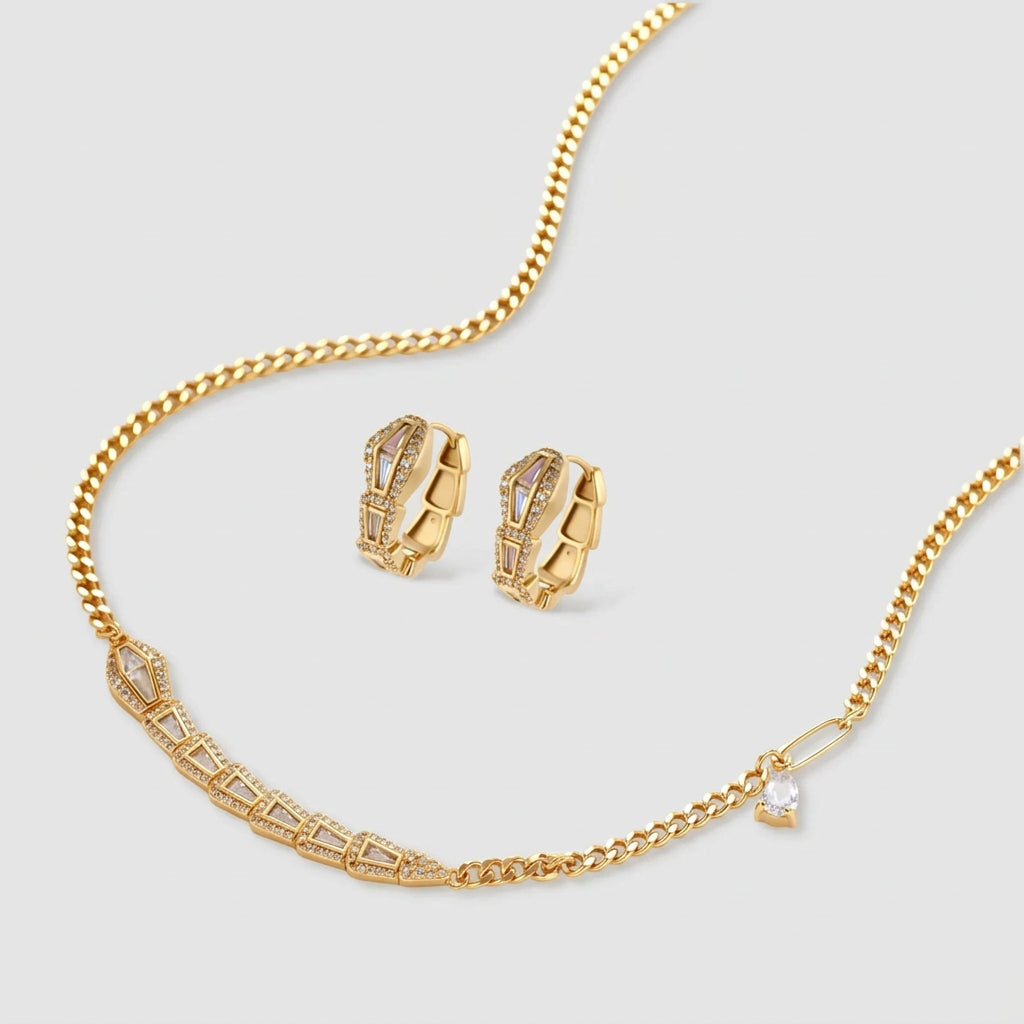 Gold-plated necklace with geometric diamond segments and matching huggie earrings featuring cubic zirconia details